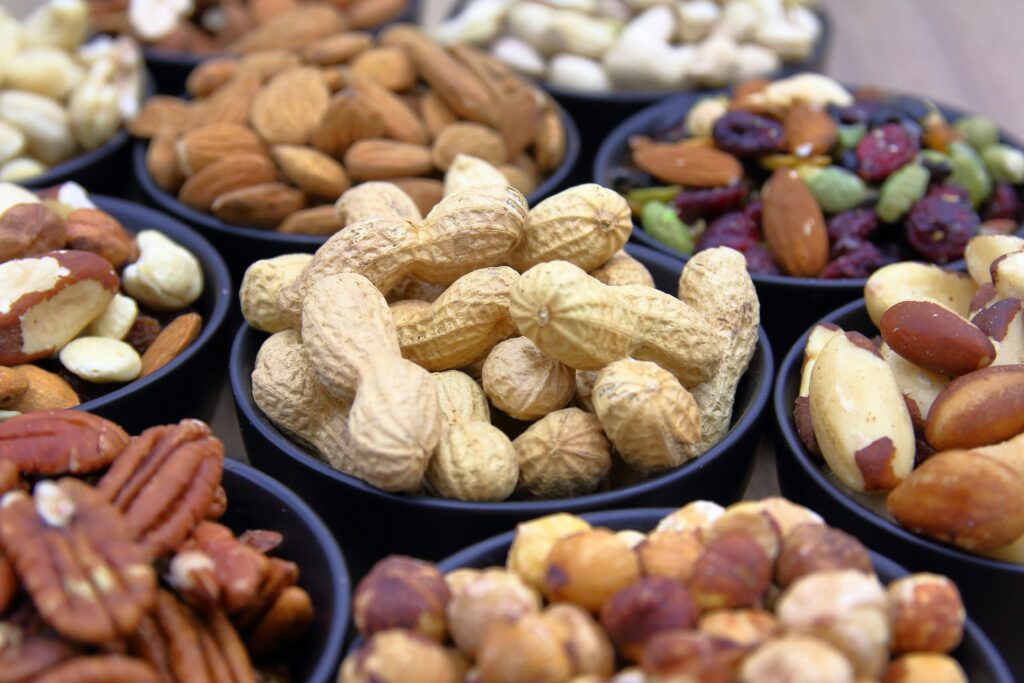 pexels-photo-32281762-32281762 A variety of nuts and seeds displayed in bowls highlighting diversity and health benefits.